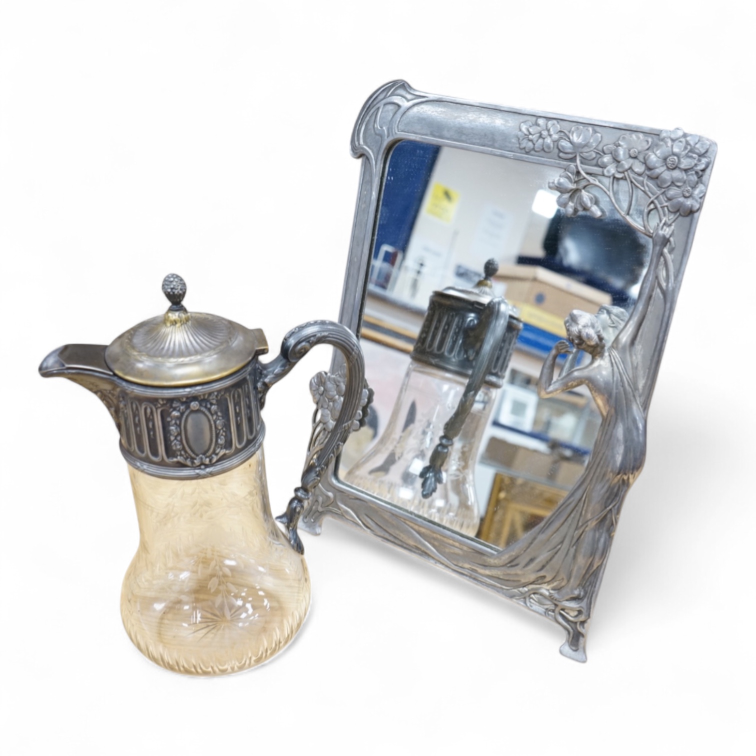 A WMF style metal mounted and engraved glass claret jug and a later figural easel mirror, tallest mirror 36cm.